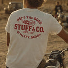 Defy the Odds tee worn, back graphic — Stuff & Company